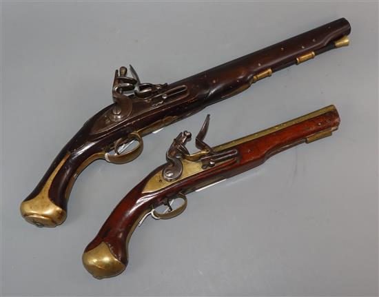 An early 19th century London flintlock pistol and a replica flintlock pistol